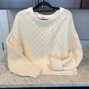 Free people cable sweater. NEVER been worn, it is an oversized cropped medium.